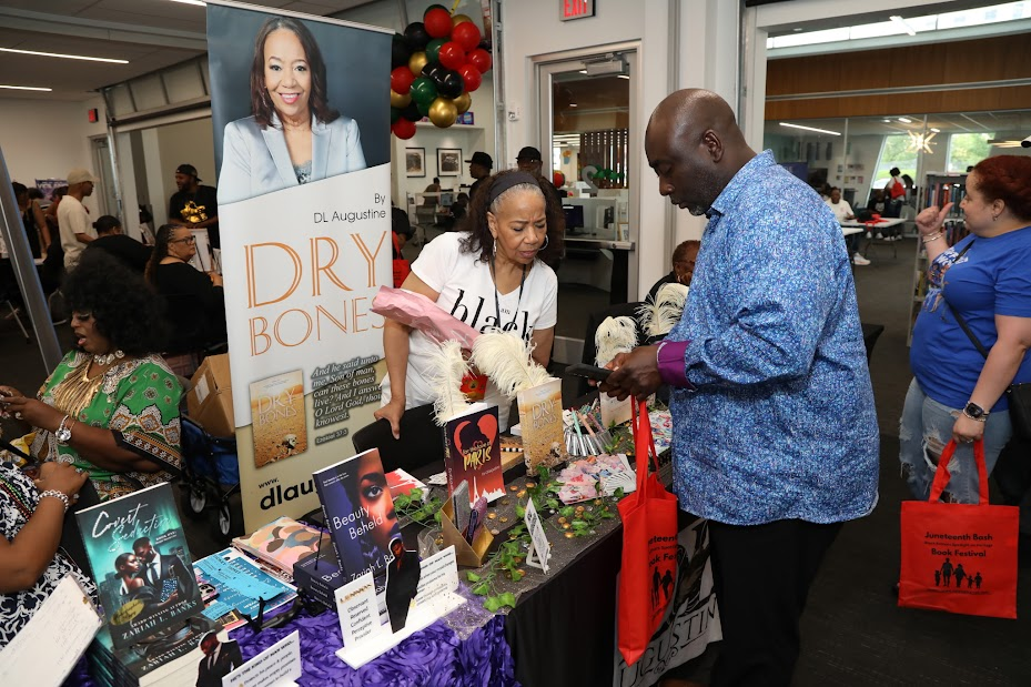 Meeting readers at the Dry Bones book table