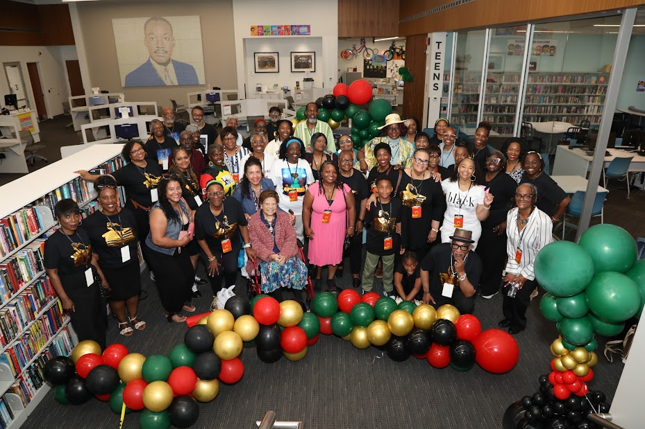 Group photo with readers and authors at the library