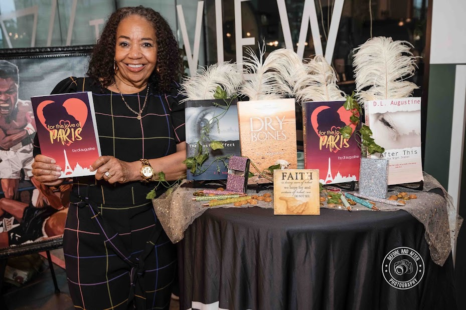 D.L. Augustine at her book table displaying her titles