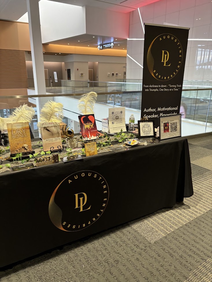 Augustine Enterprises author table at a book festival